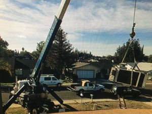 C & M Air Conditioning in Modesto with Crane at Job site
